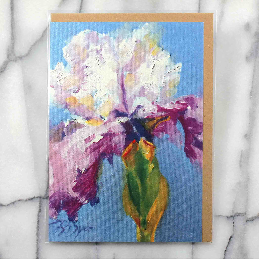 
                  
                    Load image into Gallery viewer, Little Iris Greeting Card features a freshly hued single white &amp;amp; purple iris with green stem and is juxtaposed against a vivid blue ground.  Card front, 7&amp;quot;x5&amp;quot; featured with Kraft envelope inside a protective plastic sleeve. 
                  
                