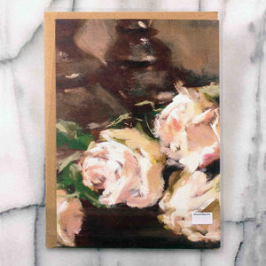 
                  
                    Load image into Gallery viewer, Bouquet of Roses Greeting Card features a bouquet of classic peachy tinted roses clustered with a single red bloom resting near a pair of candlesticks.  Card back, 7&amp;quot;x5&amp;quot; featured with Kraft envelope inside a protective plastic sleeve. 
                  
                