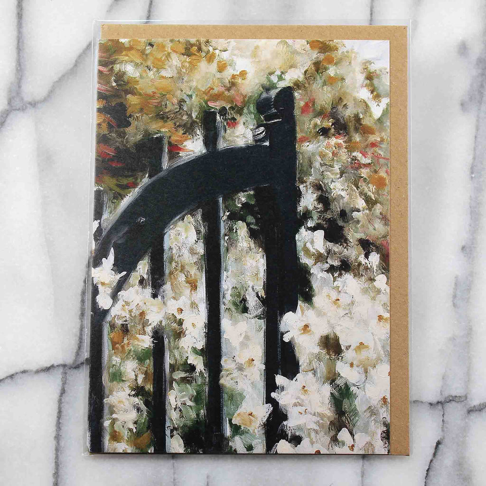 
                  
                    Load image into Gallery viewer, Gate entering into a luscious English garden with profusion of flowers against a leafy background. Front shown with Kraft envelope in a protective plastic sleeve
                  
                