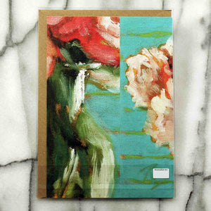 
                  
                    Load image into Gallery viewer, Peonies and Roses Greeting Card features a luscious floral bouquet of red, pink and coral flowers accented by intense green foliage. The modern turquoise and lime background reflects in a glass vase, 7&amp;quot; x 5&amp;quot;.  Card back shown with envelope inside protective plastic sleeve.
                  
                