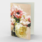 Poppies and Peonies Greeting Card presents an elegant and dreamy floral bouquet of pastel pinks, coral, cream and yellow with leafy accents that rests against a light peach background.   7" x 5”, front view, blank inside.